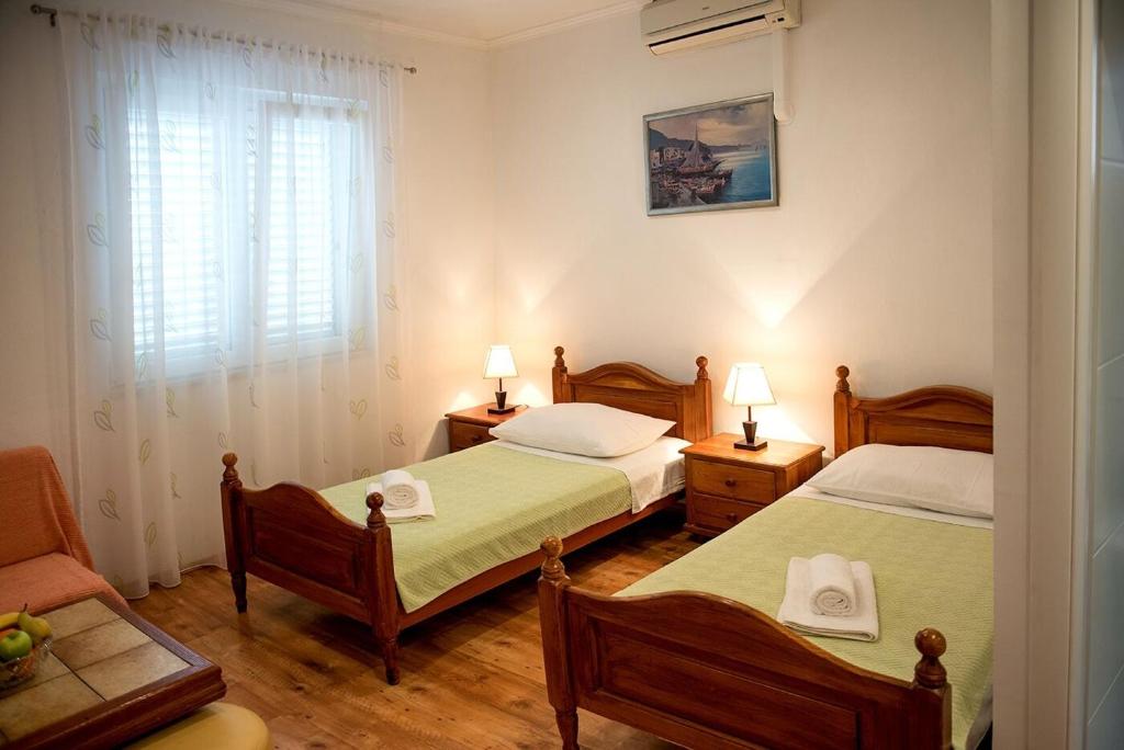 Posteľ alebo postele v izbe v ubytovaní Apartments and Rooms Robi