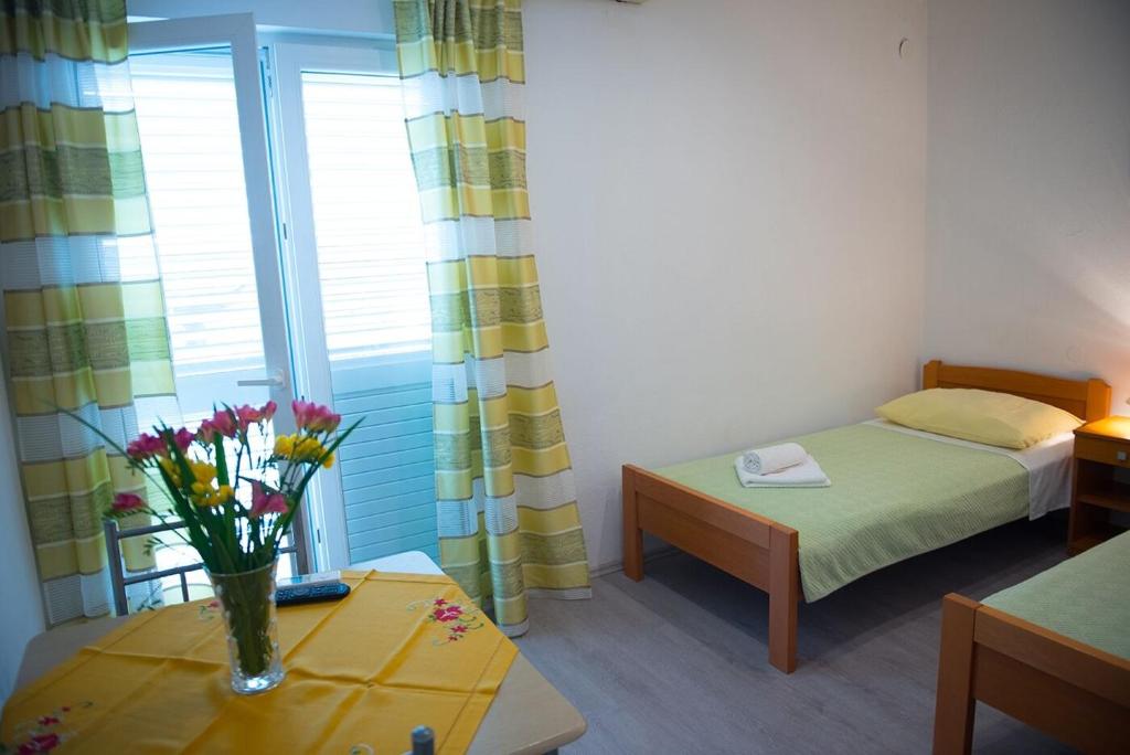 Posteľ alebo postele v izbe v ubytovaní Apartments and Rooms Robi
