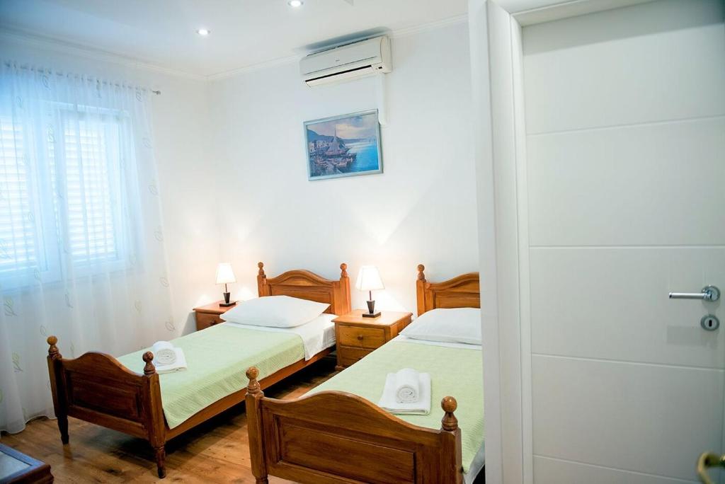 Posteľ alebo postele v izbe v ubytovaní Apartments and Rooms Robi