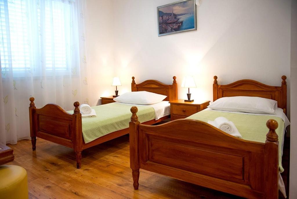 Posteľ alebo postele v izbe v ubytovaní Apartments and Rooms Robi