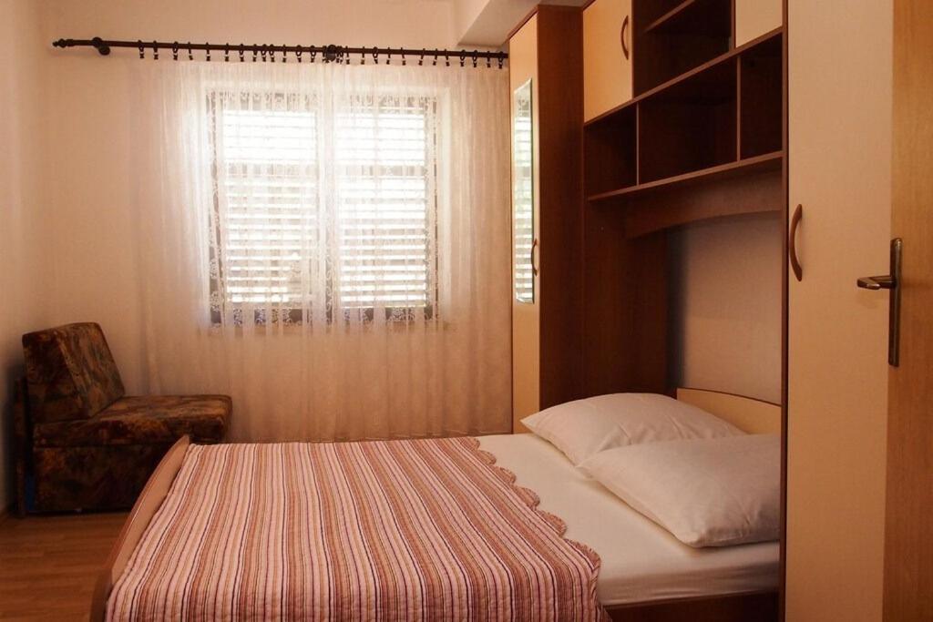 Postel nebo postele na pokoji v ubytování Apartments Ruza