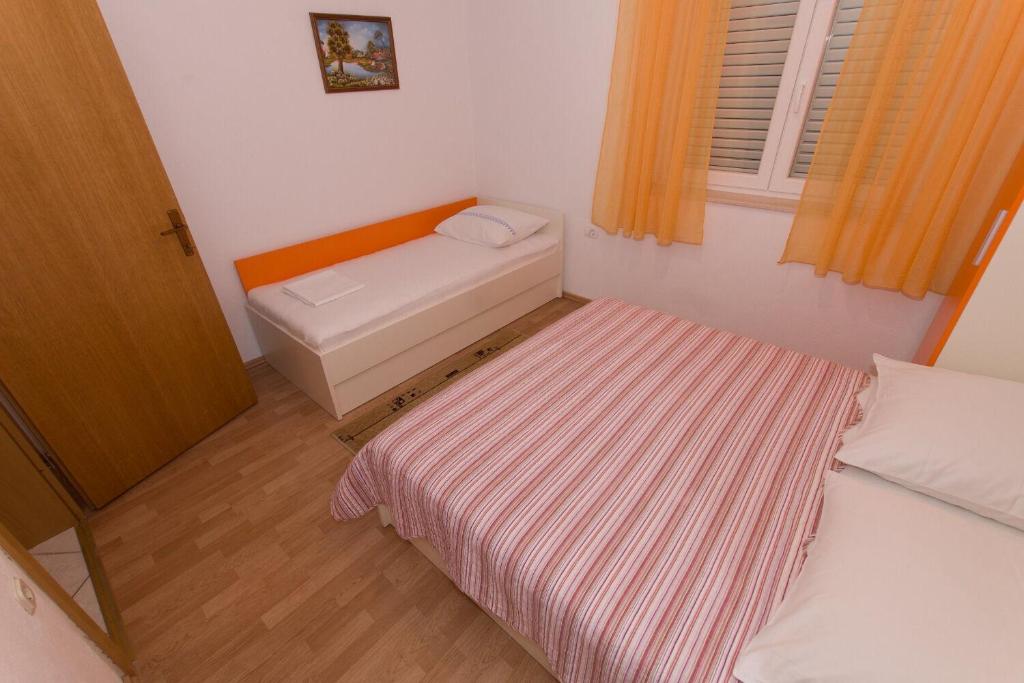 Postel nebo postele na pokoji v ubytování Apartments Ruza