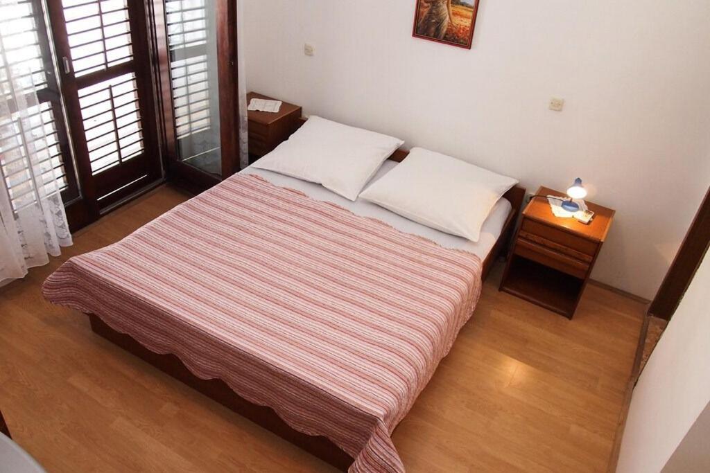 Postel nebo postele na pokoji v ubytování Apartments Ruza