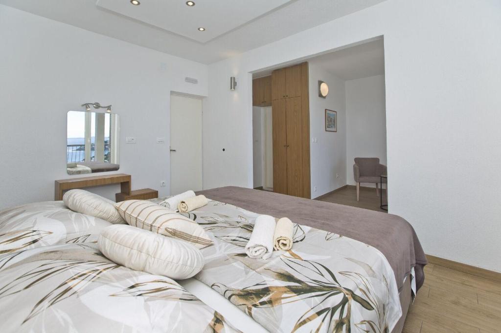 Posteľ alebo postele v izbe v ubytovaní Apartments Nadi
