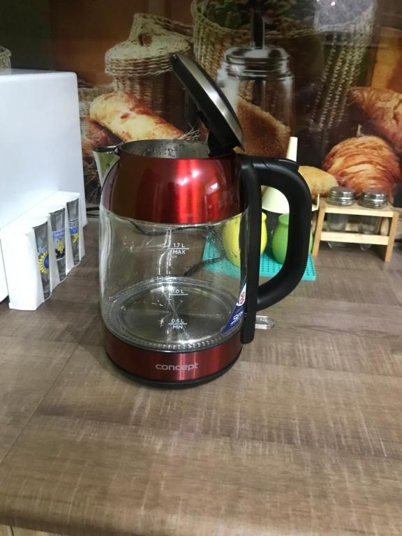 Příslušenství pro přípravu čaje a kávy v ubytování Housing HELLA