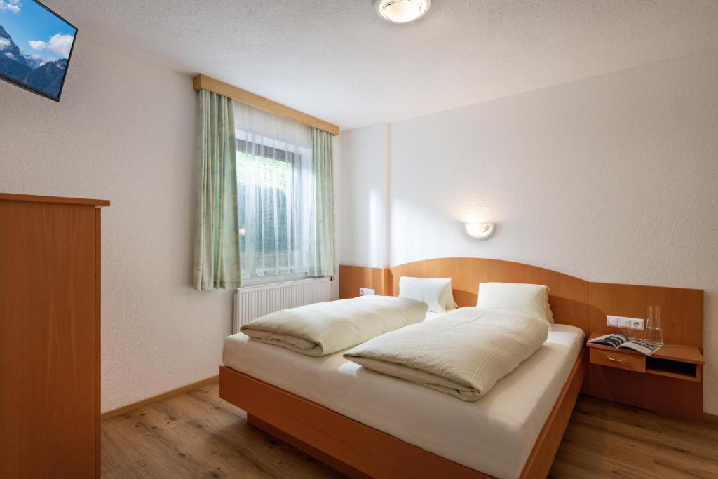 Posteľ alebo postele v izbe v ubytovaní Haus Hanser