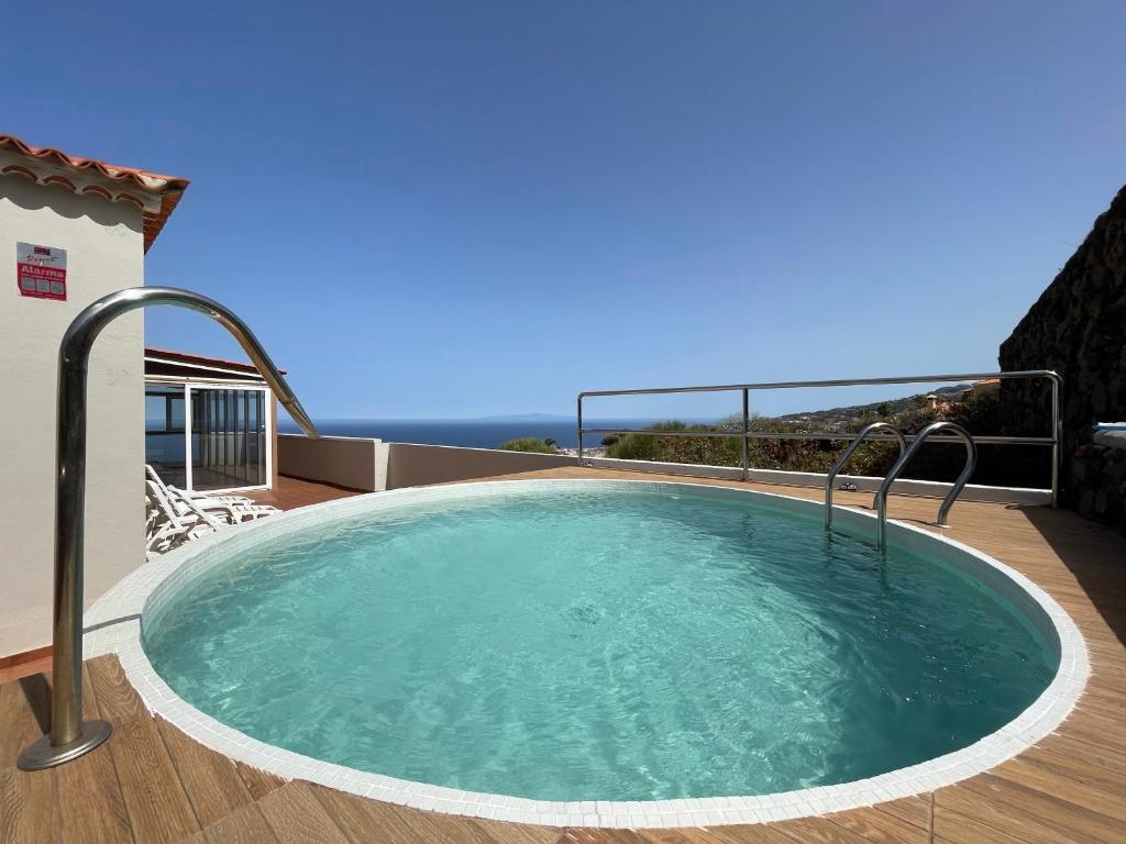 a hot tub on the deck of a house at Tendal Hosting - El Mirador de Cristina in Breña Alta