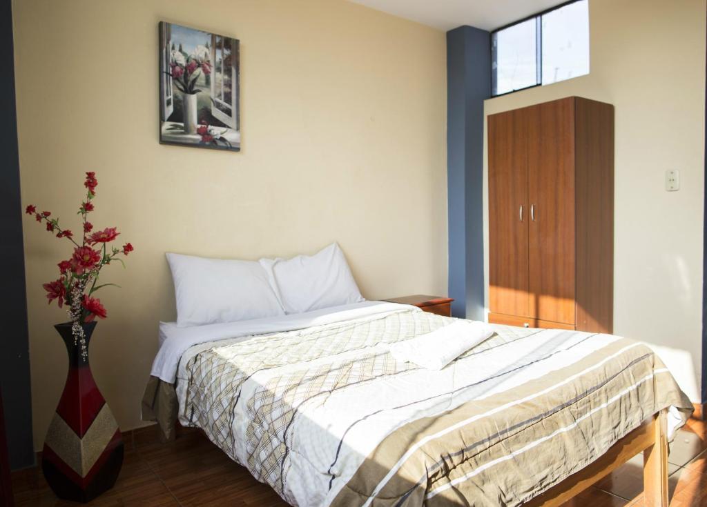 Postel nebo postele na pokoji v ubytování Musky Hs & Suites