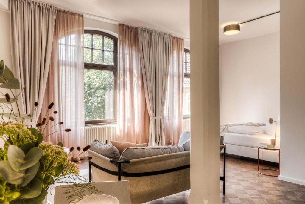 a living room with a bed and a window at Studio 9 in Fulda