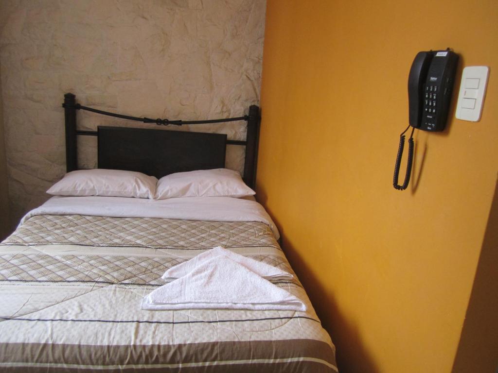 Postel nebo postele na pokoji v ubytování Musky Hs & Suites