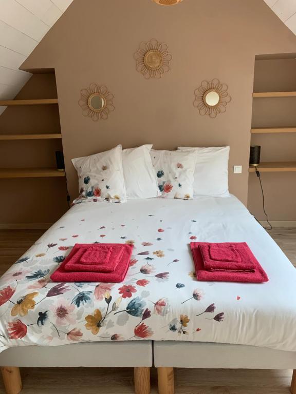 Łóżko lub łóżka w pokoju w obiekcie Gîte du moulin vert