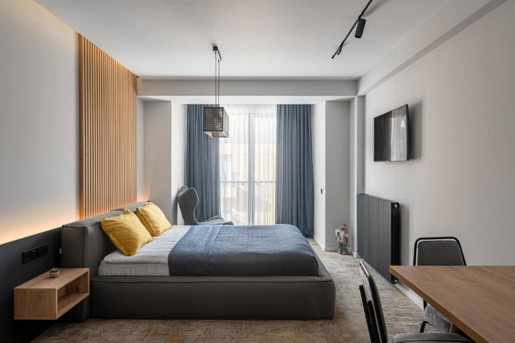 Postel nebo postele na pokoji v ubytování Premium Apartment in New Gudauri
