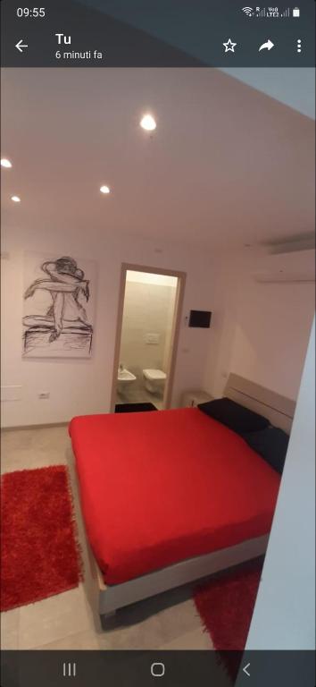 Postel nebo postele na pokoji v ubytování Casa Rosso Blu