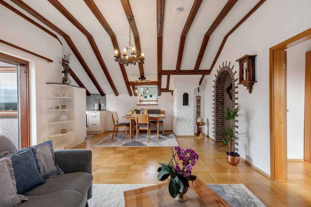 a living room with a couch and a table at Ferienwohnung Fernsicht in Zwiefalten