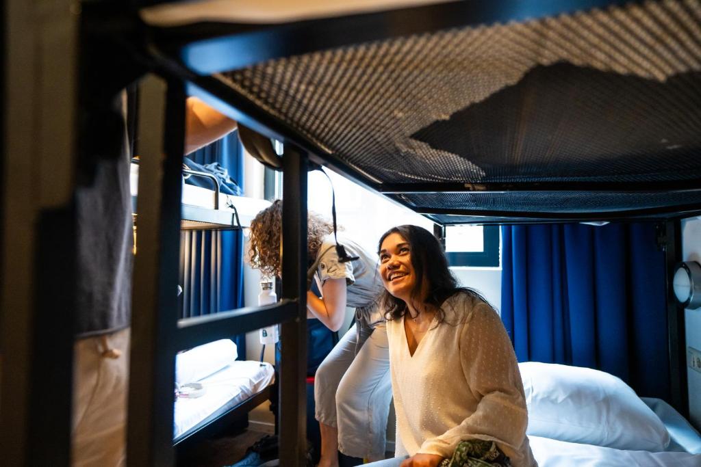 Postel nebo postele na pokoji v ubytování Bud Gett Hostels