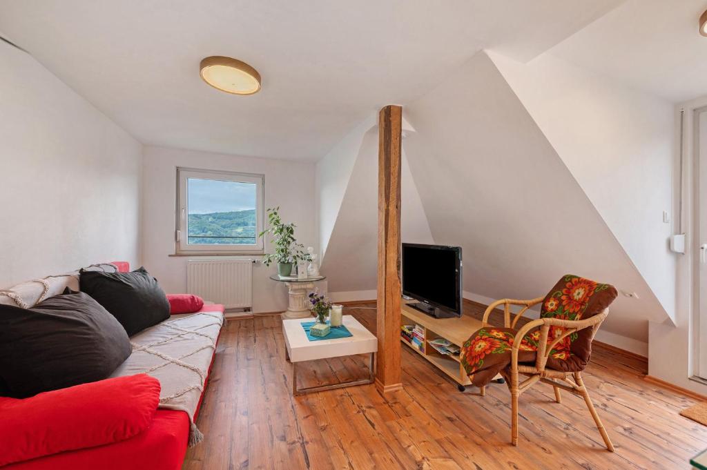 TV a/nebo společenská místnost v ubytování Ferienwohnung im Rosenberg