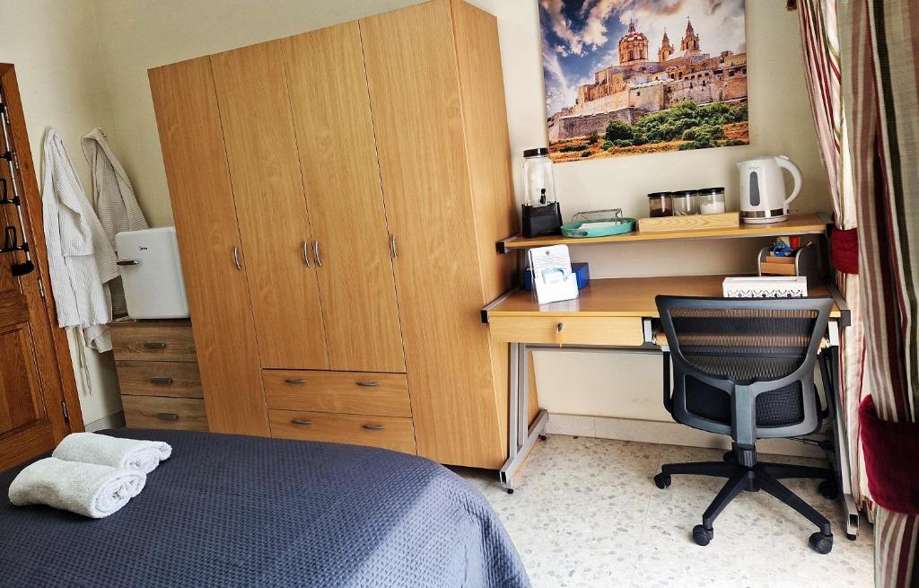 Postel nebo postele na pokoji v ubytování Saracini's Homestay