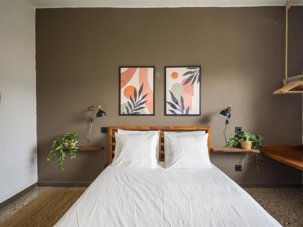 a bedroom with a bed with two white pillows at Samar Retreat in Teror