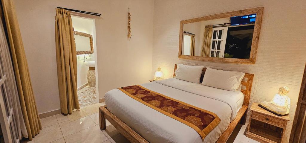 Ένα ή περισσότερα κρεβάτια σε δωμάτιο στο Central Canggu Guesthouse