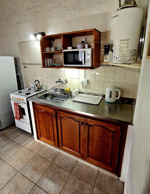 Kuchyň nebo kuchyňský kout v ubytování Punto Sur Cabañas