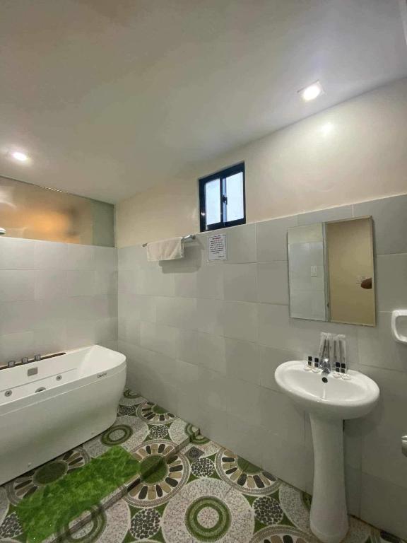 Koupelna v ubytování Belladama Hotel