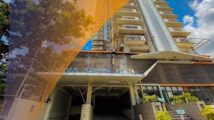 a large building with a balcony on the side of it at Mabolo Garden Flats Bnb in Cebu City