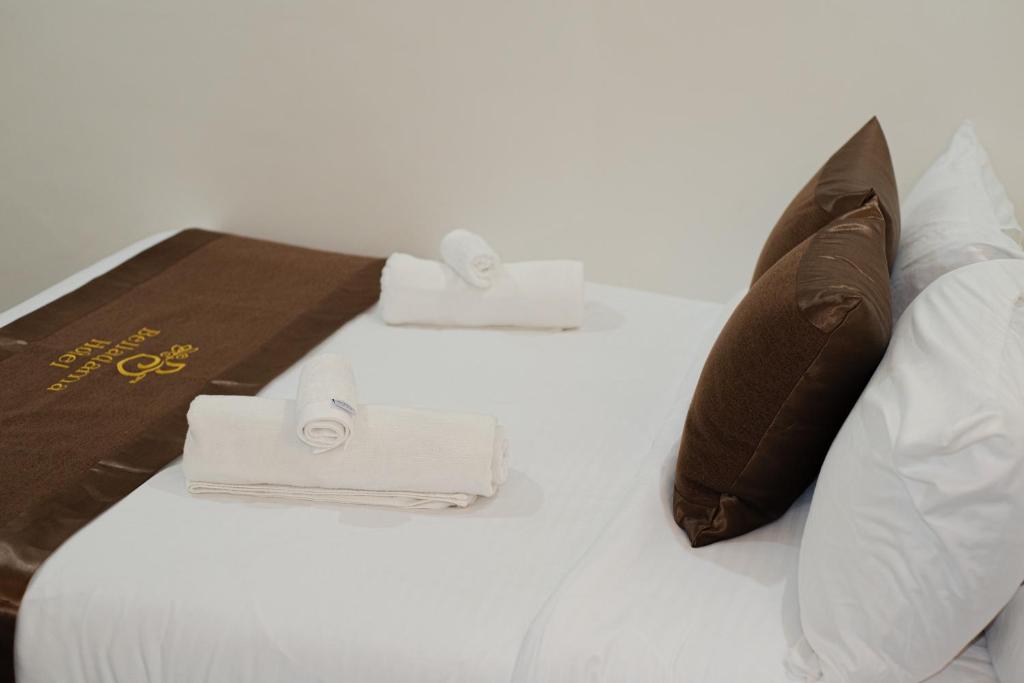 Postel nebo postele na pokoji v ubytování Belladama Hotel