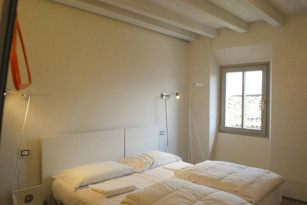 Postel nebo postele na pokoji v ubytování La Corte - Theater Home