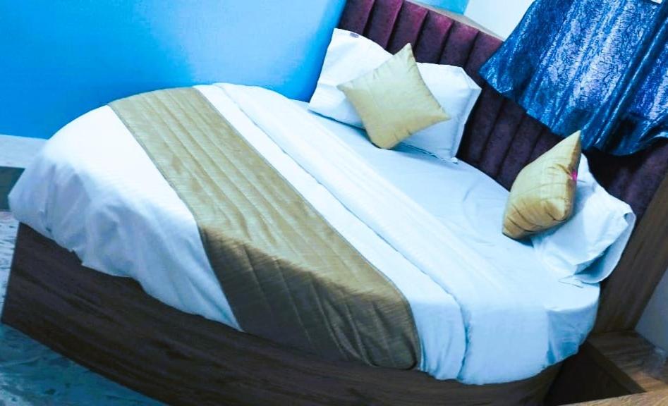 Postel nebo postele na pokoji v ubytování Hotel Sunrise Rooms