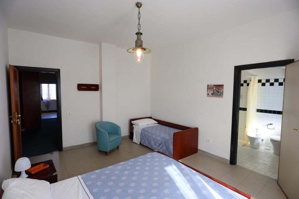 Postel nebo postele na pokoji v ubytování Hotel Barracuda