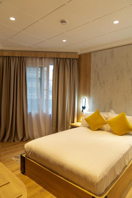 Letto o letti in una camera di Hotel Charf