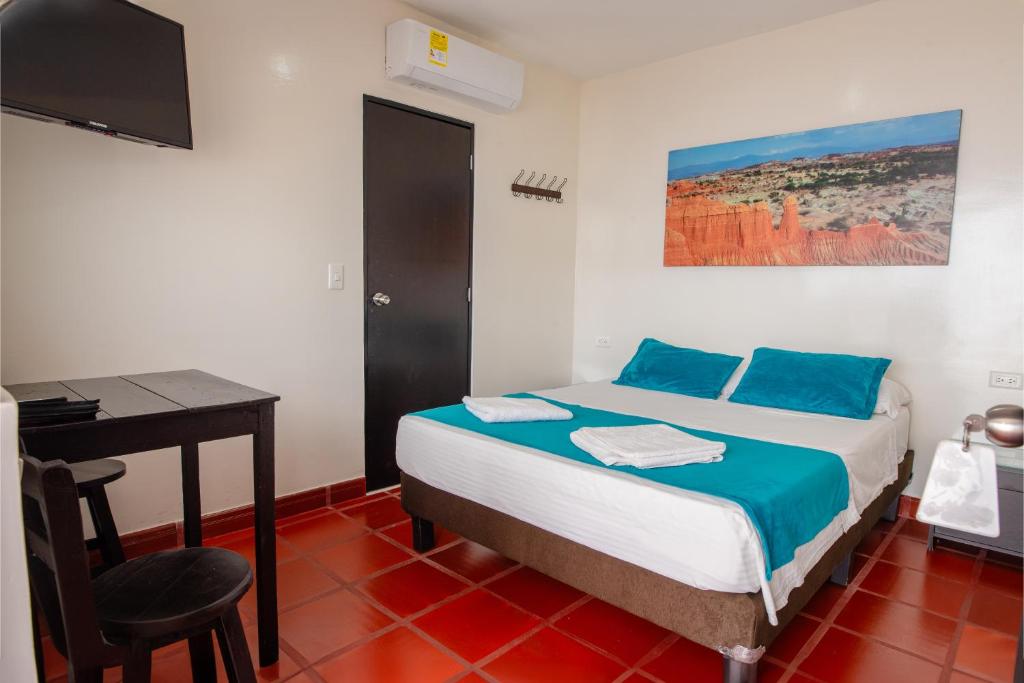 Postel nebo postele na pokoji v ubytování Hotel Villa Paraiso