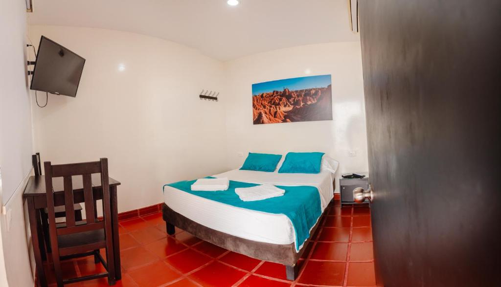 Postel nebo postele na pokoji v ubytování Hotel Villa Paraiso