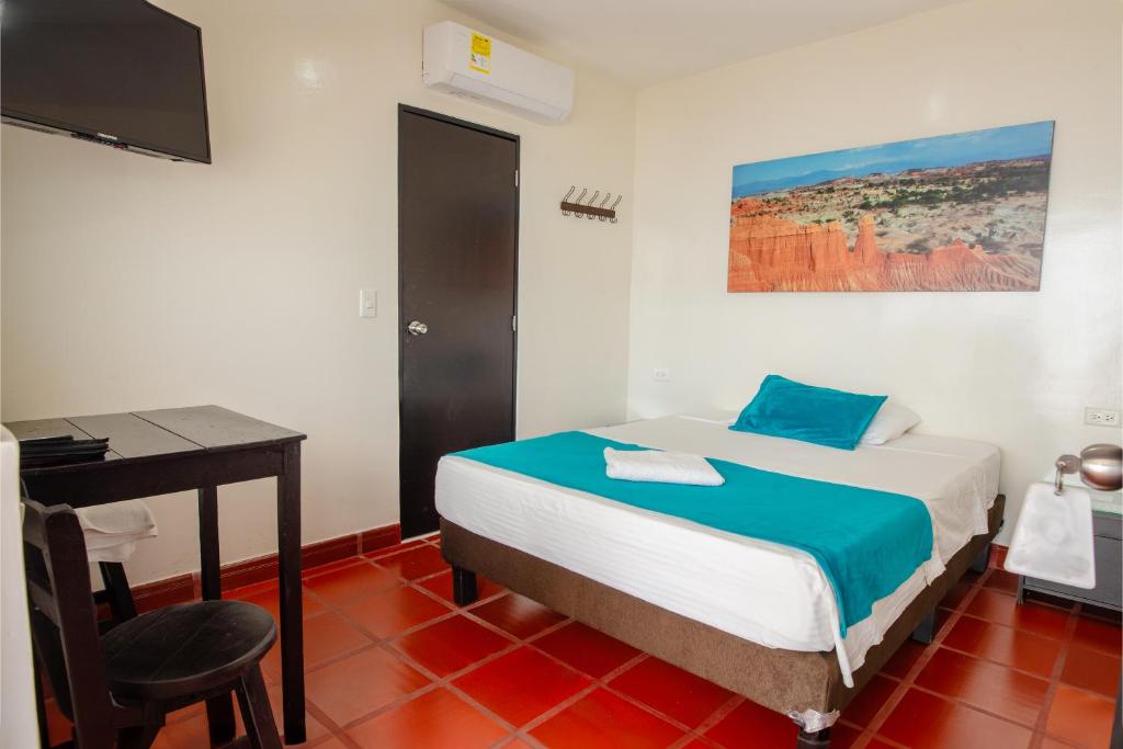 Postel nebo postele na pokoji v ubytování Hotel Villa Paraiso