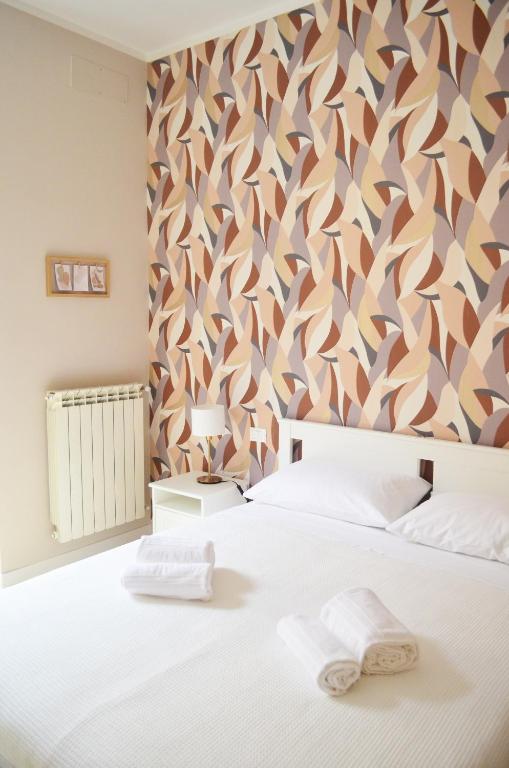 Letto o letti in una camera di Casa Ninetta Caprarola
