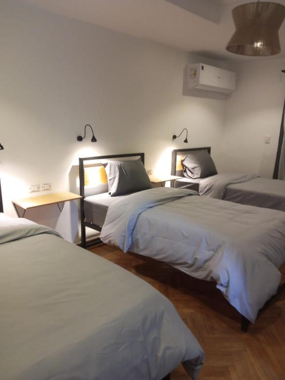 Postel nebo postele na pokoji v ubytování Pyramids Nights Hostel