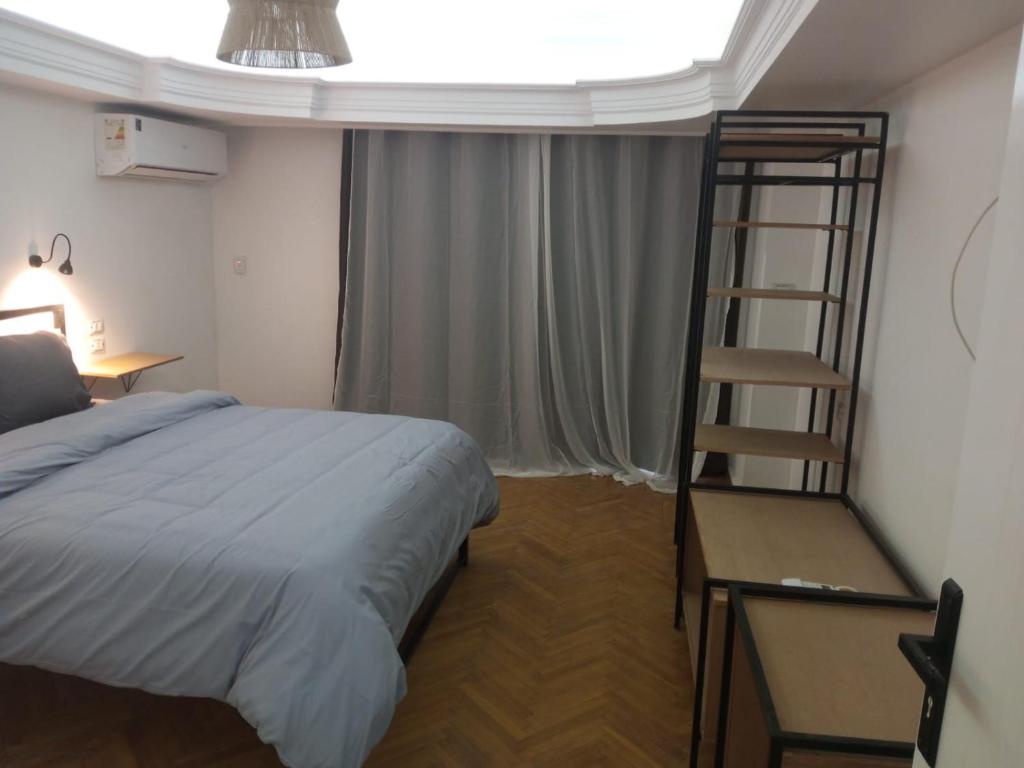 Postel nebo postele na pokoji v ubytování Pyramids Nights Hostel