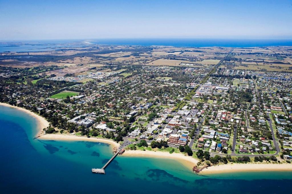 an aerial view of a city on the beach at 9/4 The Esplanade, Cowes - Cscape in Cowes
