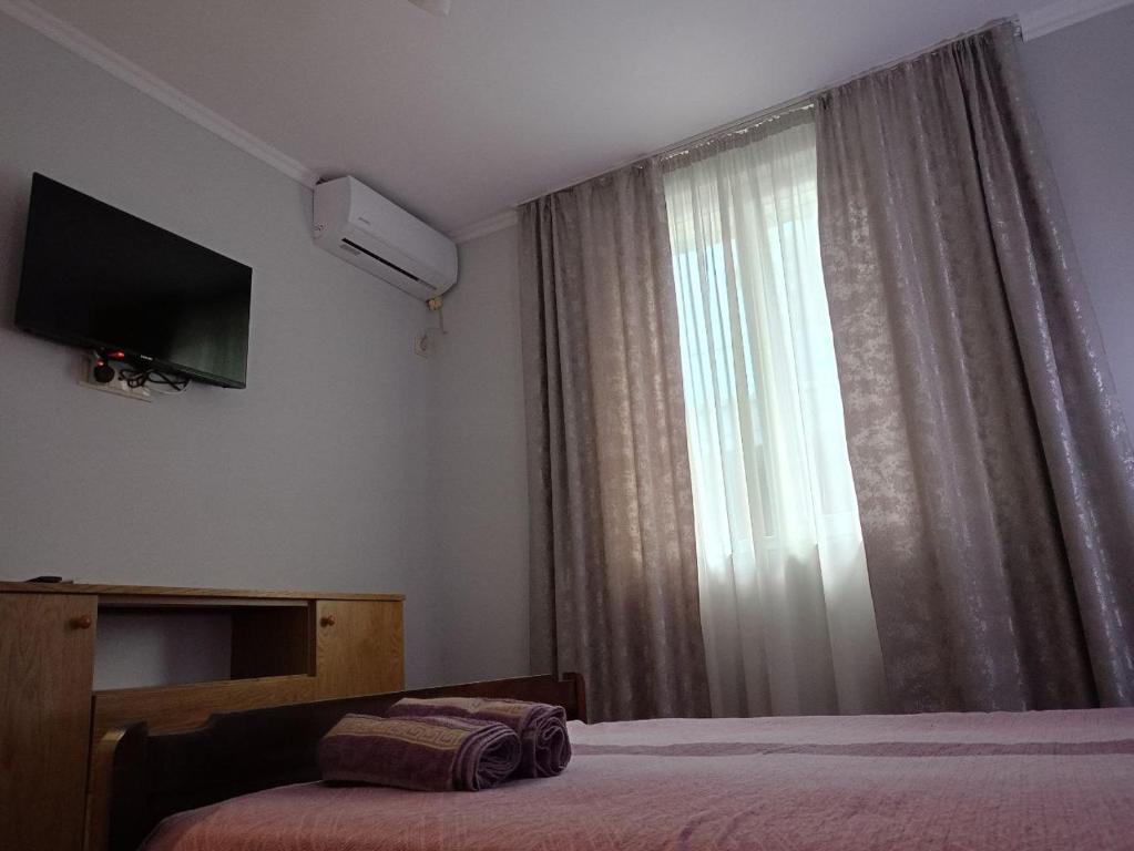 Postel nebo postele na pokoji v ubytování Guest house on Devyatnadtsataya
