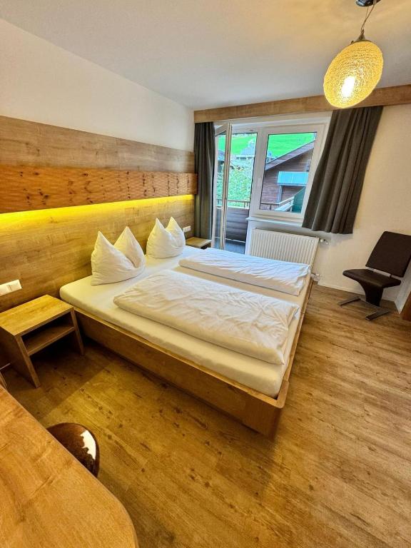 Postel nebo postele na pokoji v ubytování Pension Ahorn