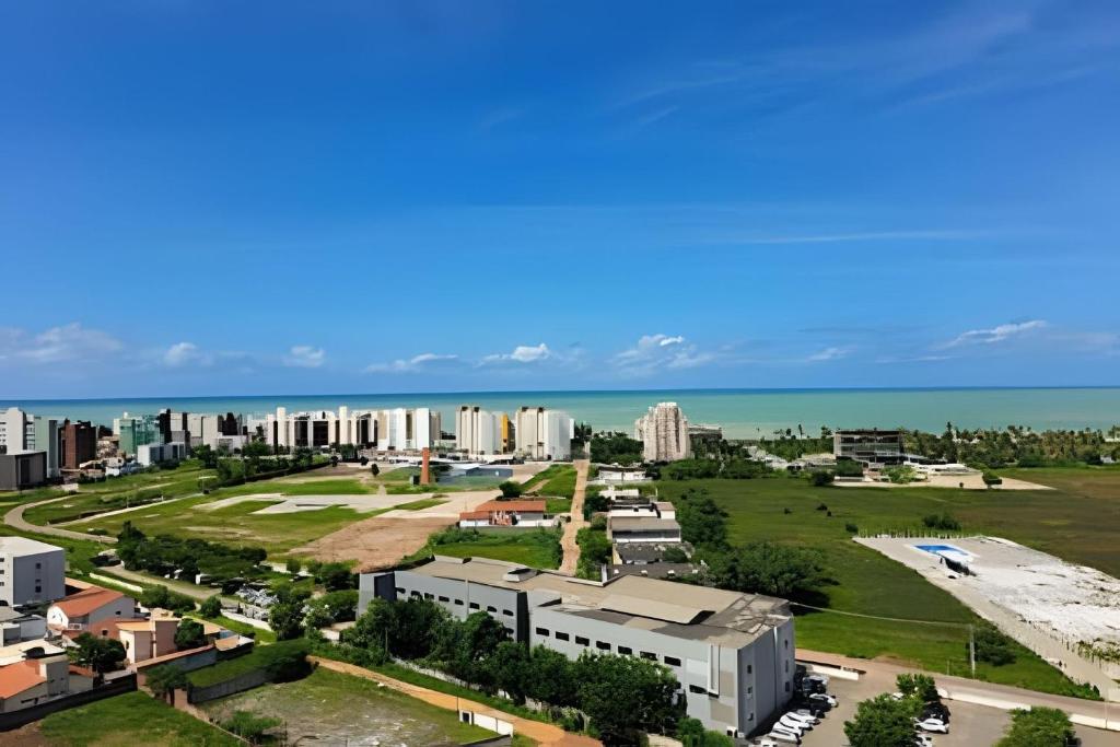 an aerial view of a city with buildings and the ocean at (1506)Apt 2 Quartos Cabedelo- Ponta de Campina in Tambauzinho