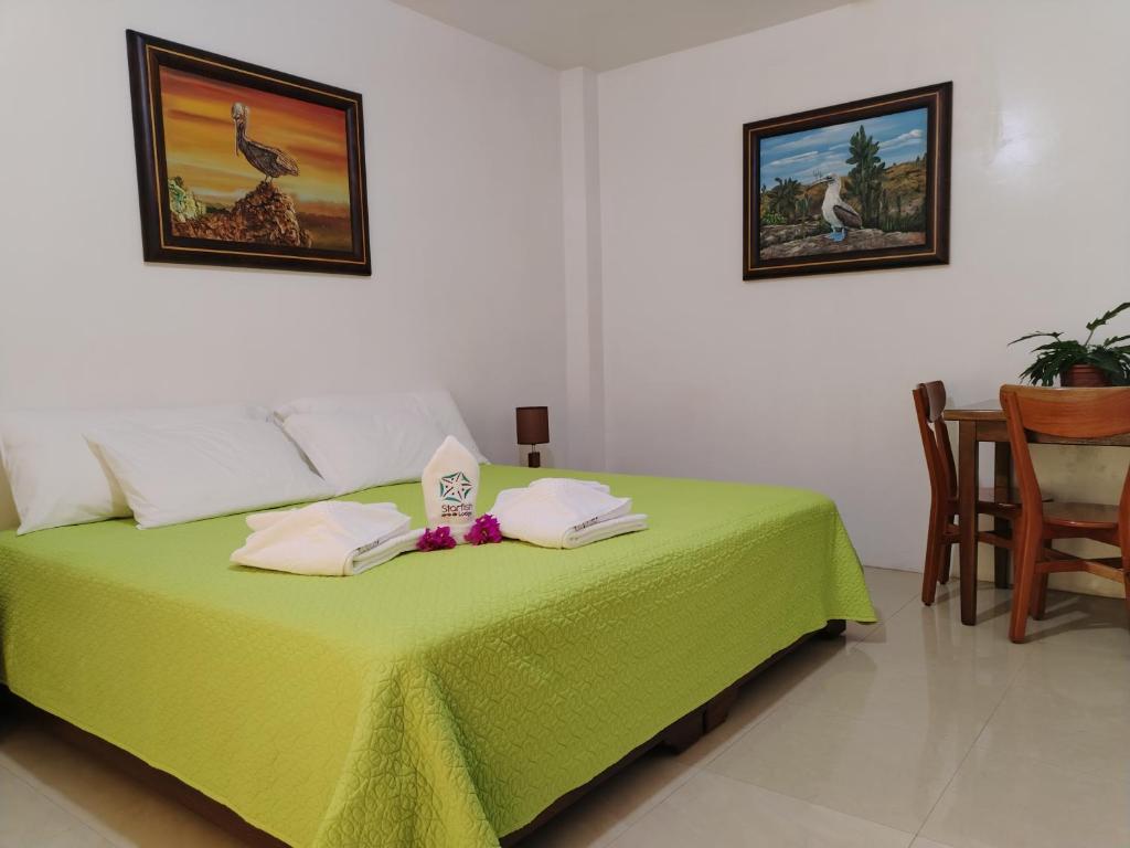 Postel nebo postele na pokoji v ubytování Hotel StarFish