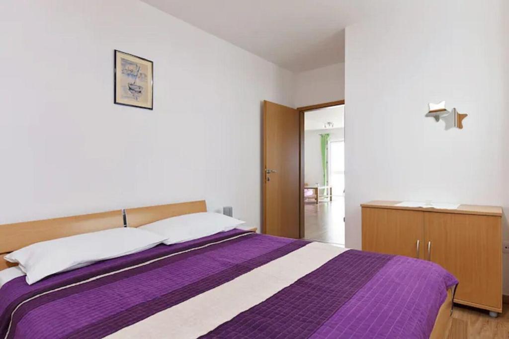 Posteľ alebo postele v izbe v ubytovaní Apartment Ljilja