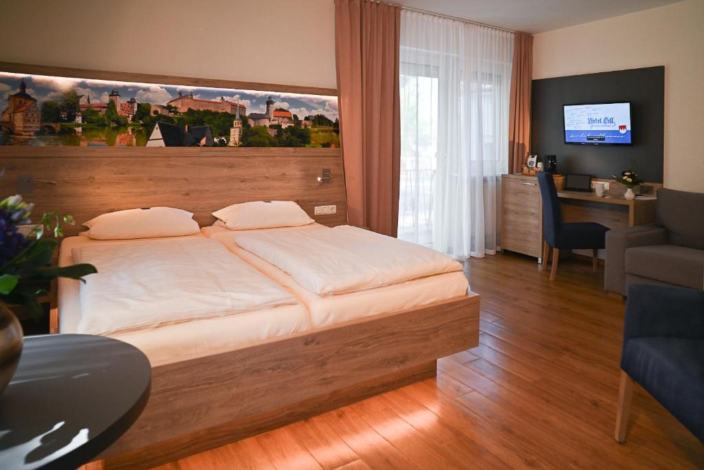 Postel nebo postele na pokoji v ubytování Hotel Ertl