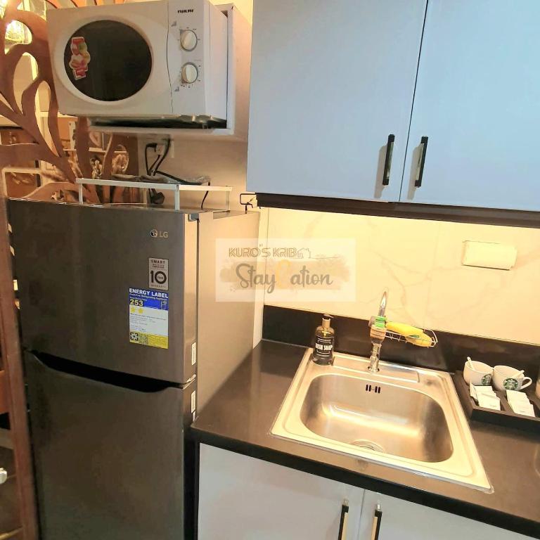 Kuchyň nebo kuchyňský kout v ubytování Condo in Pasay S Residences