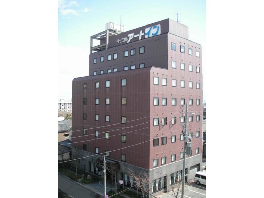 新潟市にあるTerminal Art Inn - Vacation STAY 97387vの上に看板がある建物
