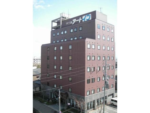 新潟市にあるTerminal Art Inn - Vacation STAY 97387vの上に看板がある建物
