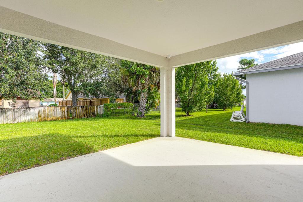 an empty patio with a view of a yard at Explore Parks and Preserves! Spacious St Lucie Home in Port Saint Lucie
