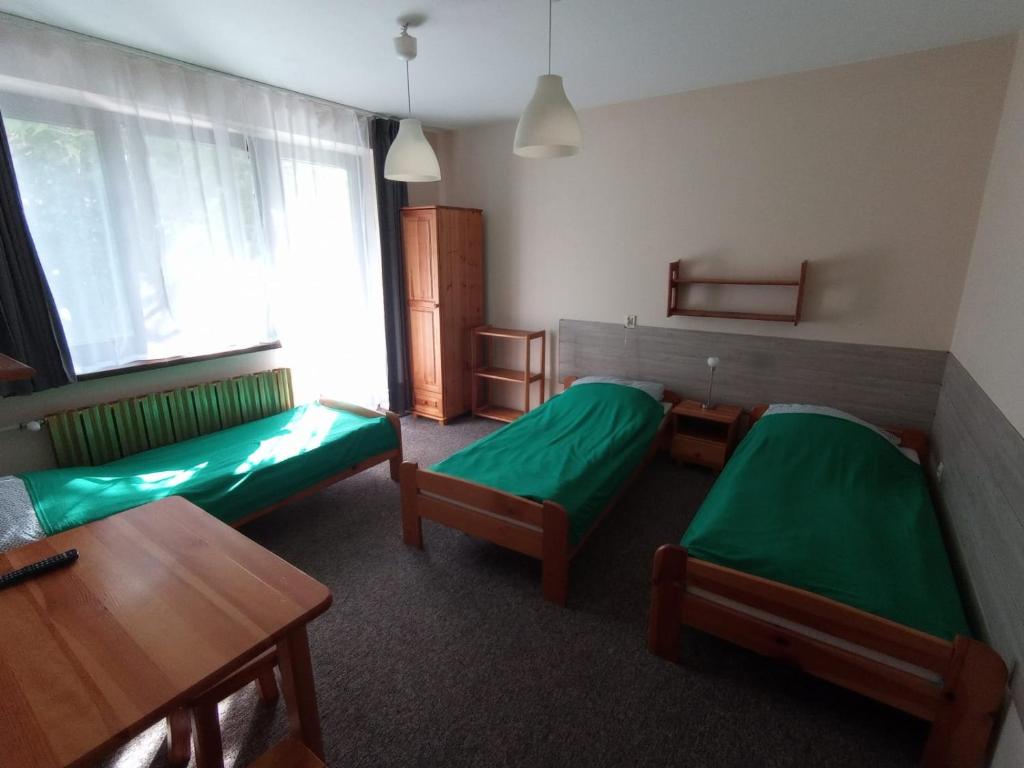 Noclegi Pod Dębem - Basic Triple Room With Shared Bathroom