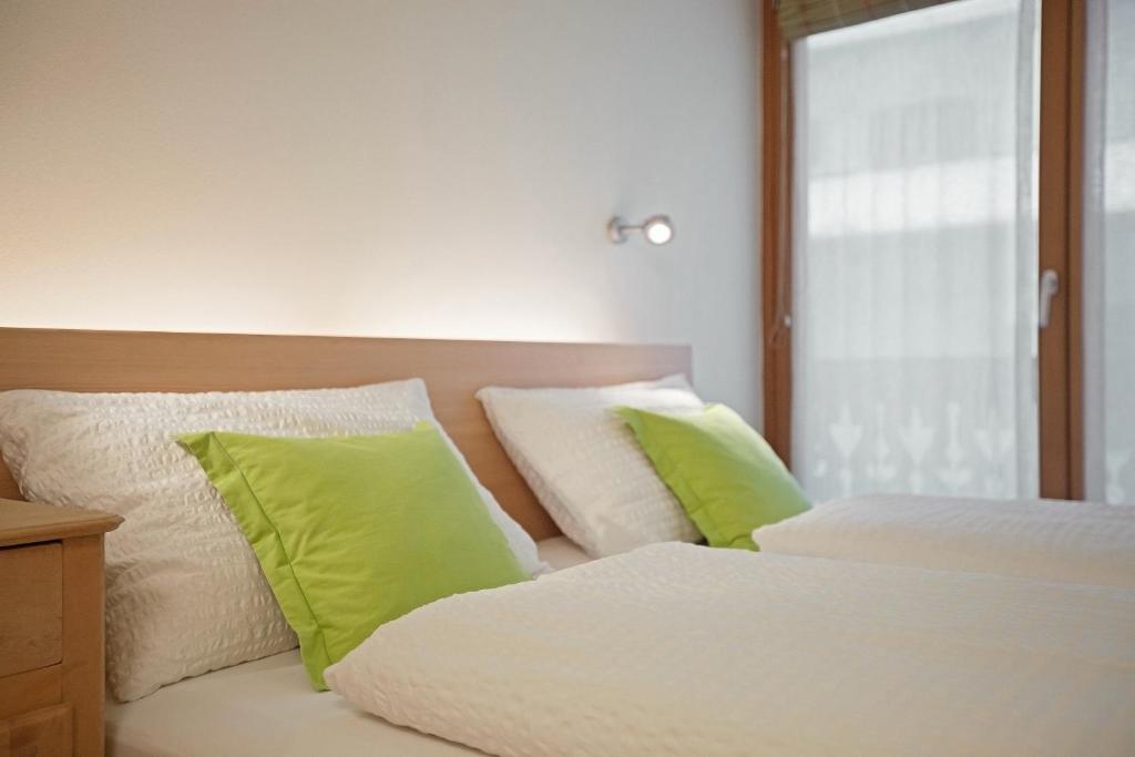 Postel nebo postele na pokoji v ubytování Alpine Rooms and Suites Livigno - Camana Noa -